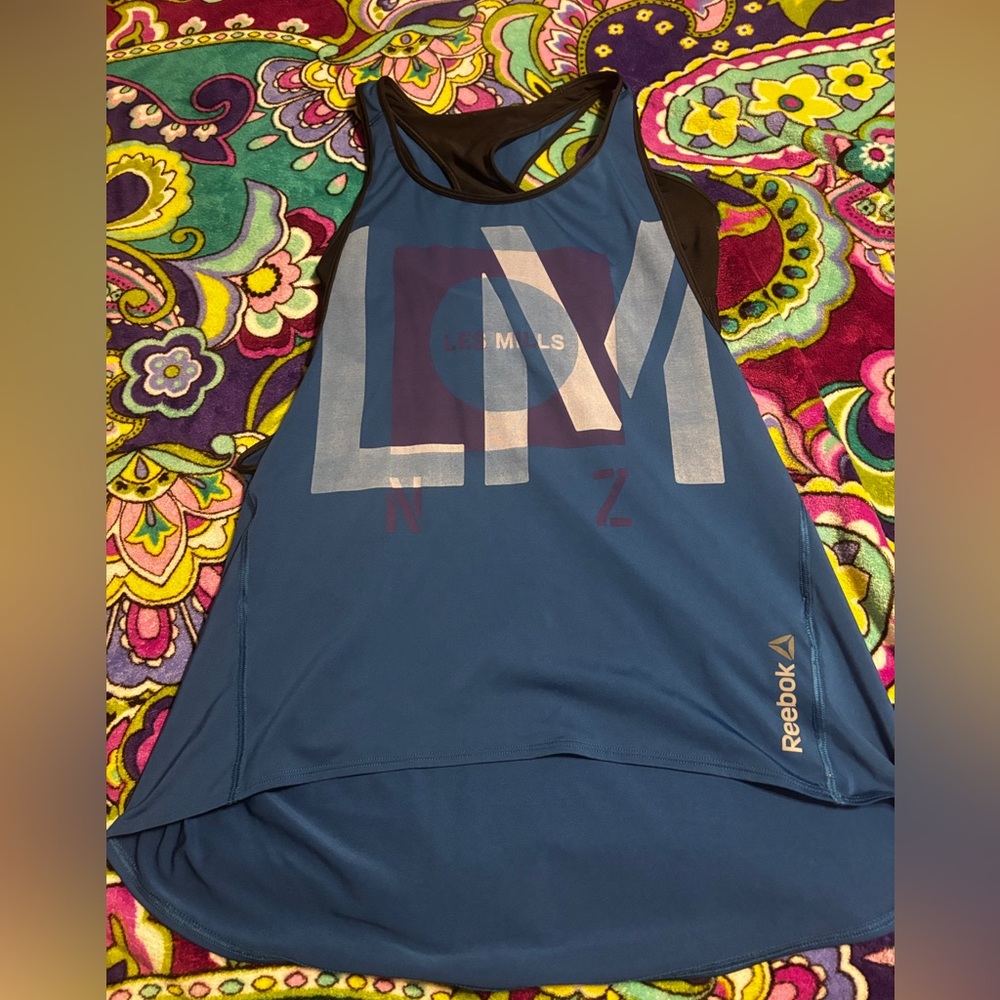 Les Mills Reebok Blue Graphic Tank Top with built in bra 
SMALL